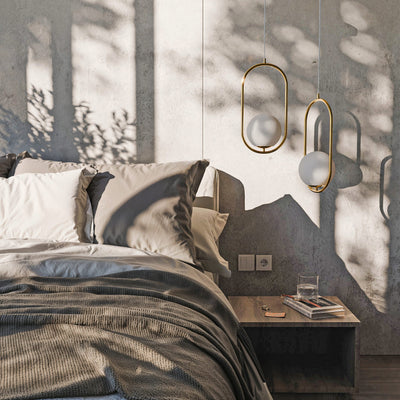 Orbitella Pendant Lamp with Spherical Shade in a Gold Frame, Modern Style – in a room setting
