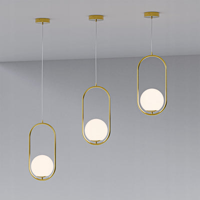 Orbitella Pendant Lamp with Spherical Shade in a Gold Frame, Modern Style – in a room setting