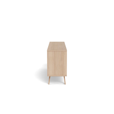 Lurisse chest of drawers, 200x75, bleached oak – side view showing the depth of the unit and the slightly slanted oak legs