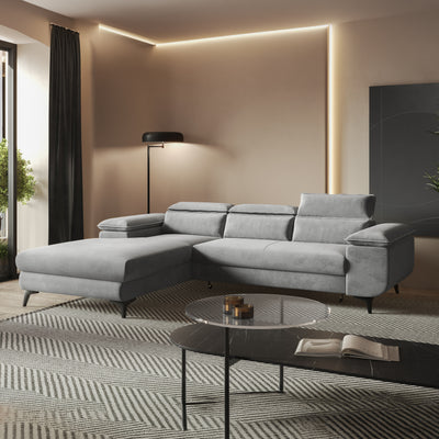 Bessi corner sofa, 276x205, Ash Mist (MONOLITH 84), in a warmly lit living room by a glass coffee table – living room corner sofa
