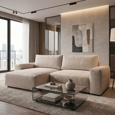 Iskeli corner sofa, Creamy Taupe (ARAGON 03), left-hand version, in a living room with a glass coffee table and a painting – living room corner sofa