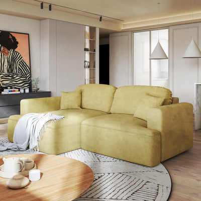 Senvali corner sofa 240 cm in Golden Sepia (CLOUD 32), left-hand version, in a living room with a round table and a throw on the chaise longue